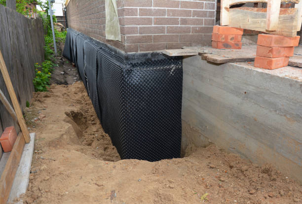 Happy homeowners after waterproofing job in Macatawa